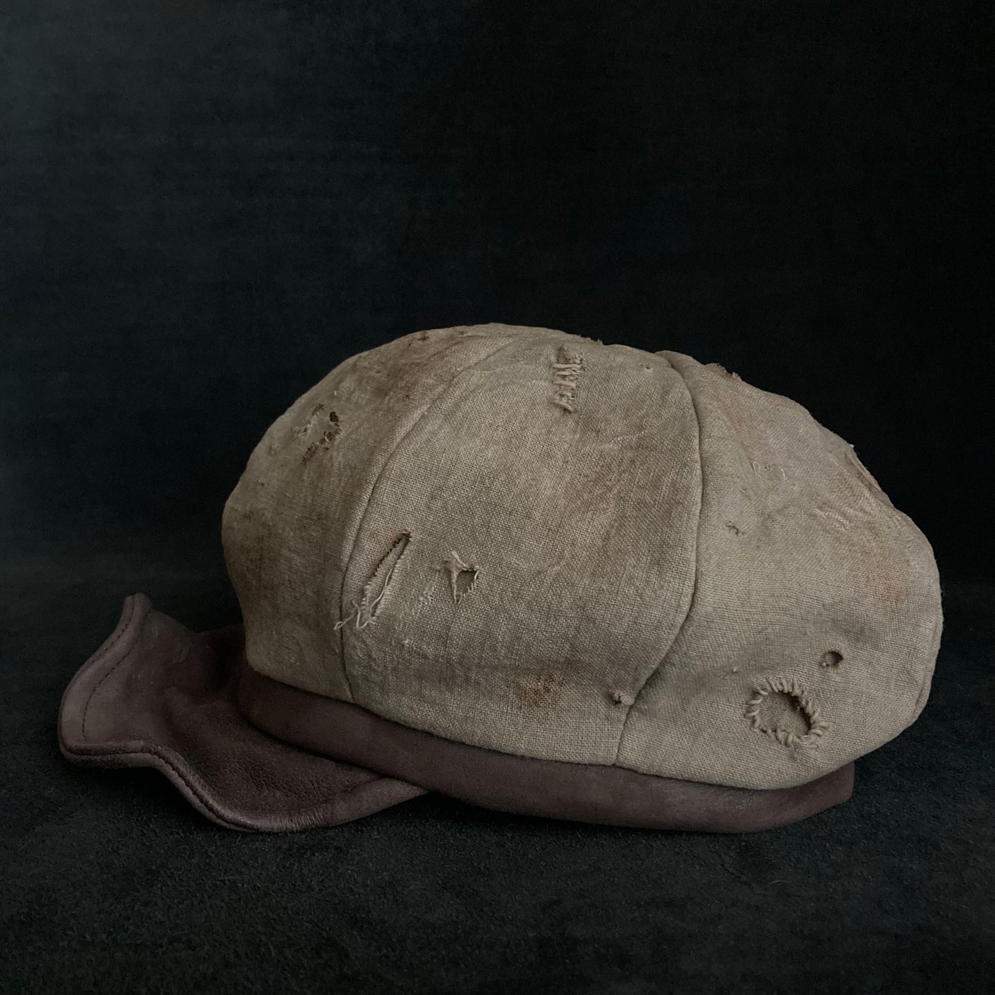 Sand tatters damage linen casquette