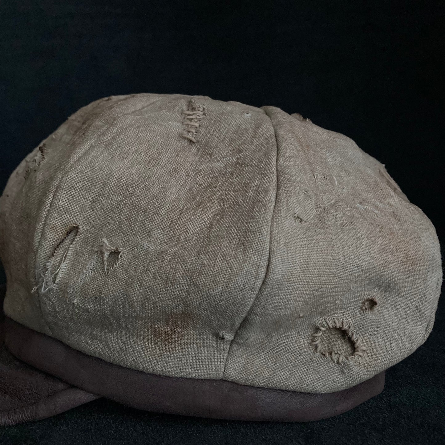 Sand tatters damage linen casquette