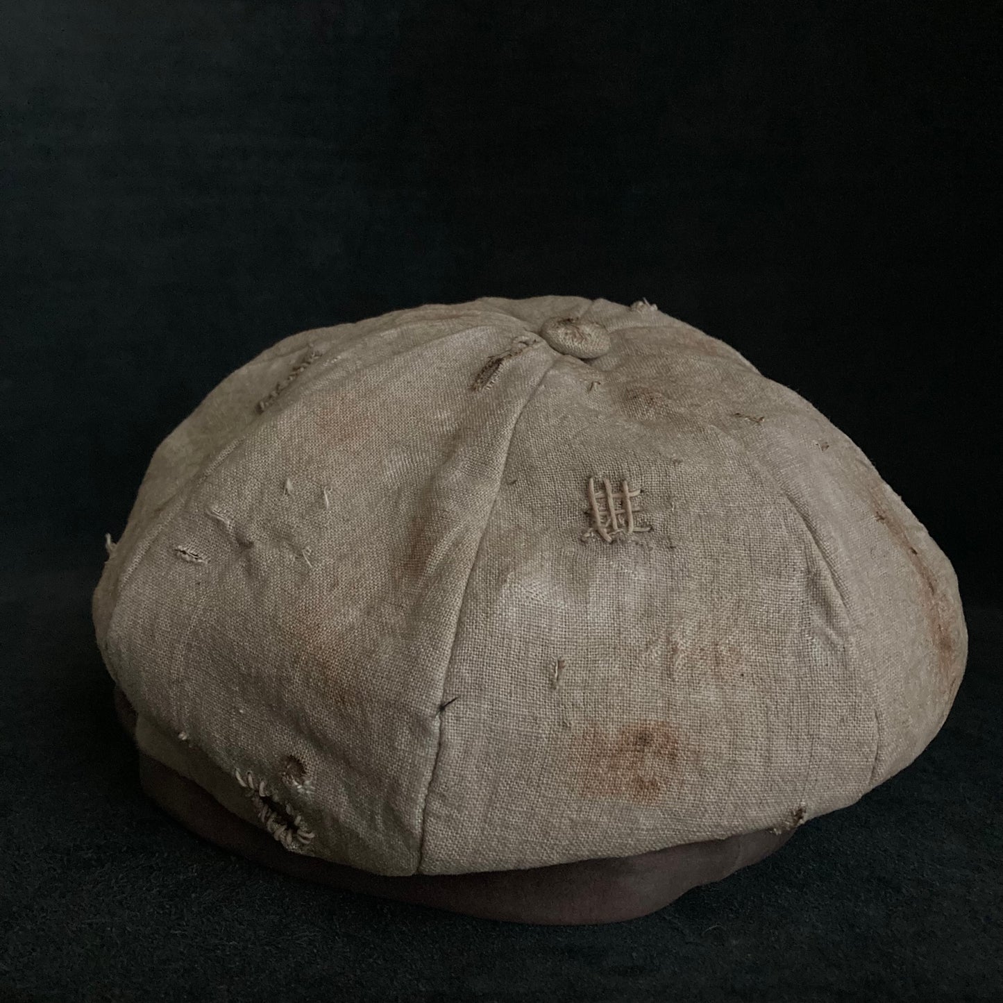 Sand tatters damage linen casquette