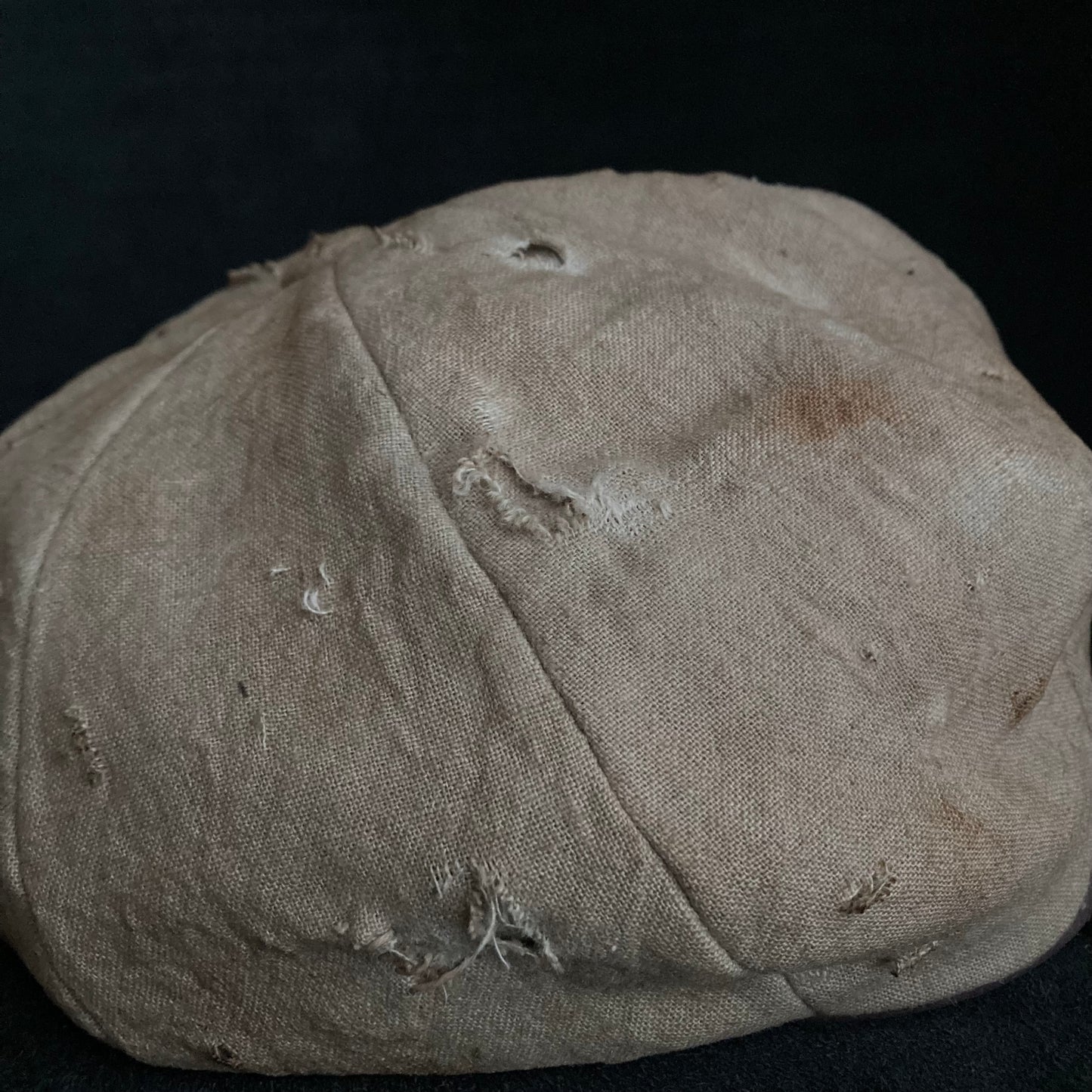 Sand tatters damage linen casquette