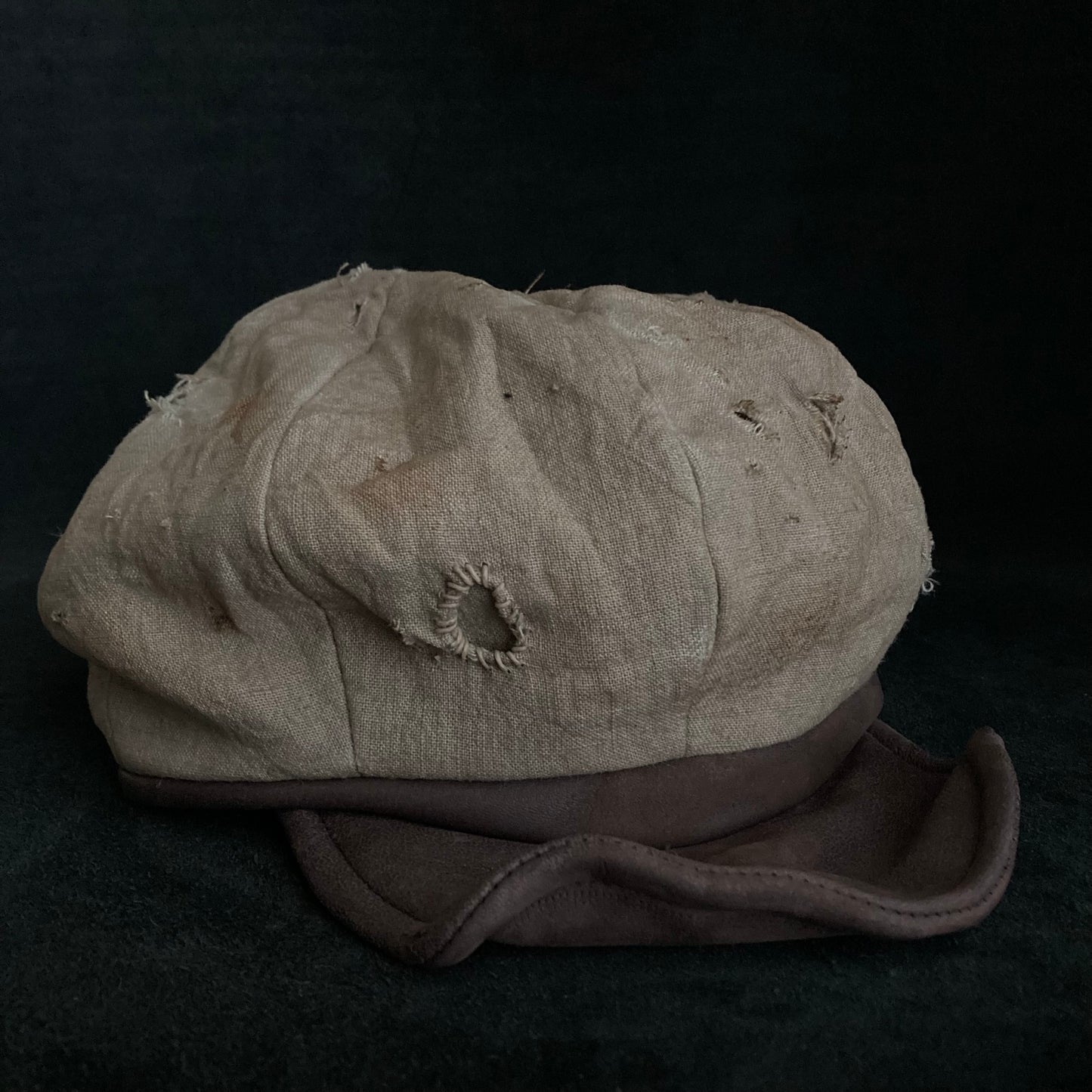 Sand tatters damage linen casquette