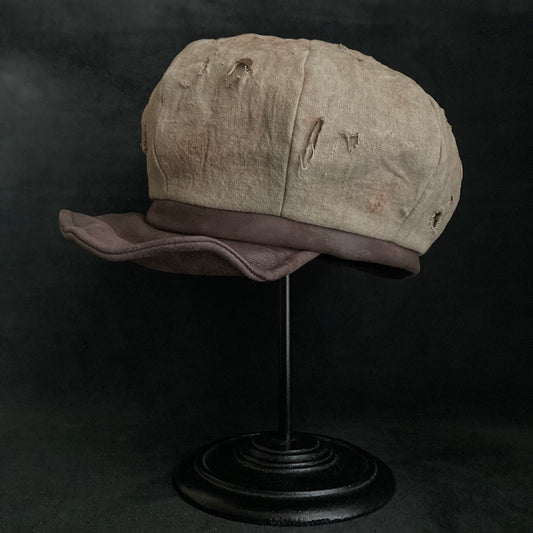 Sand tatters damage linen casquette