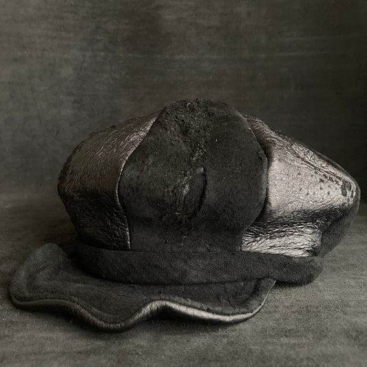 Peelable damage black leather casquette