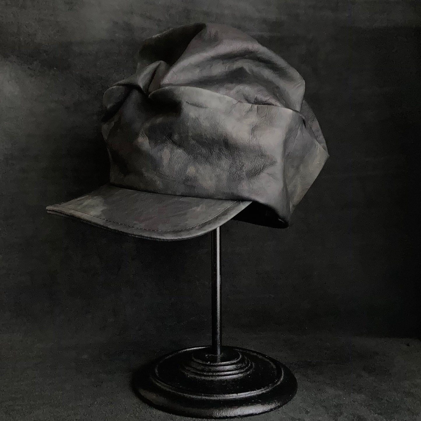 Rainy black leather turn cap