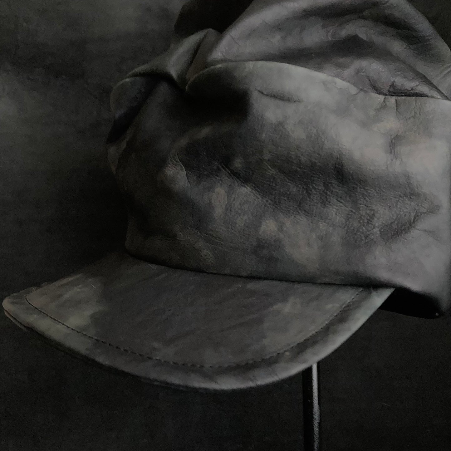 Rainy black leather turn cap