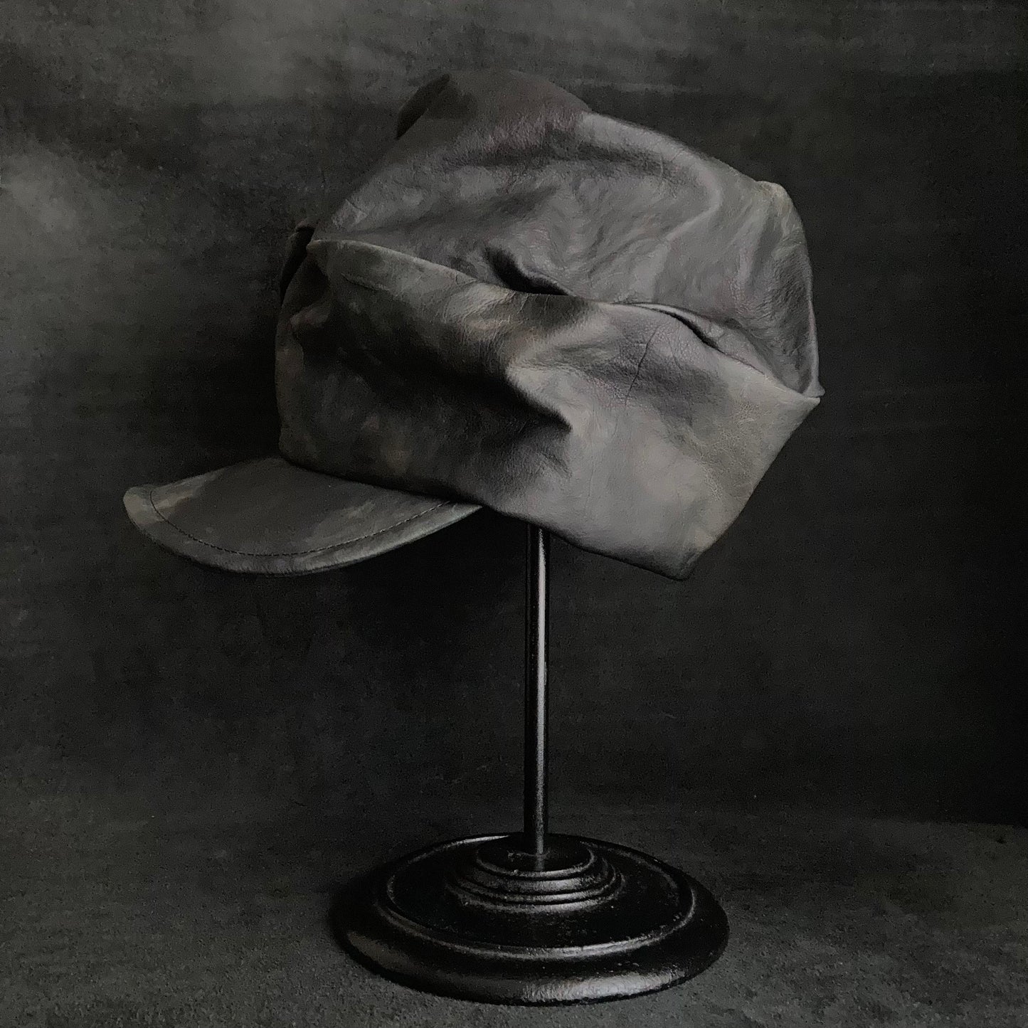 Rainy black leather turn cap