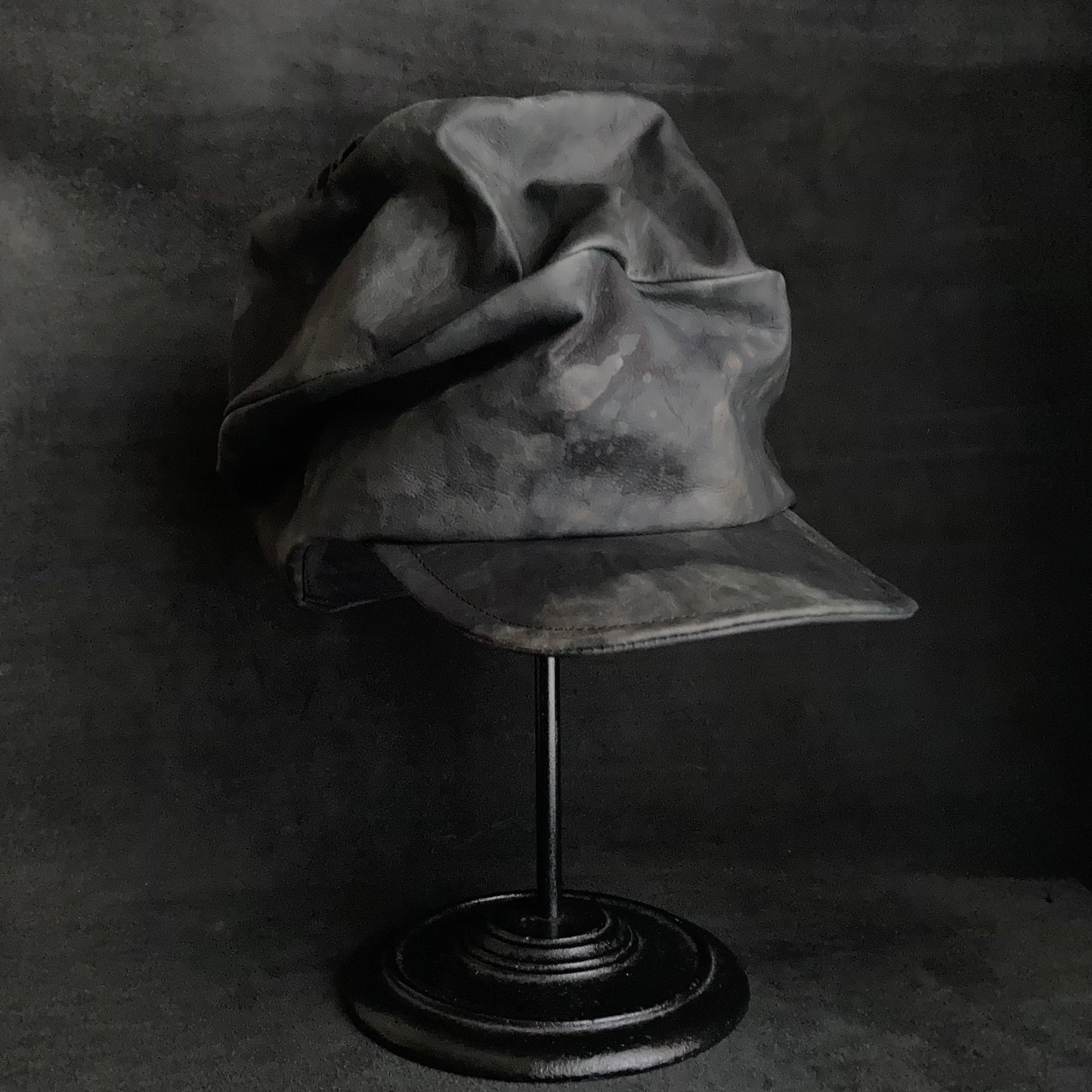 Rainy black leather turn cap