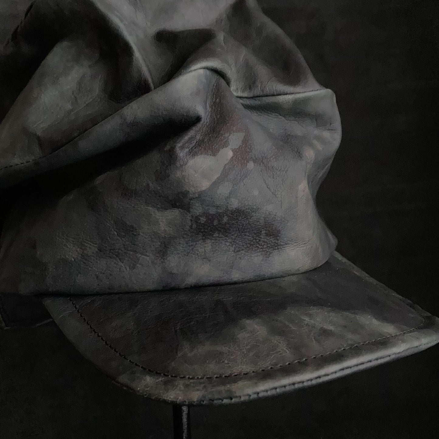 Rainy black leather turn cap