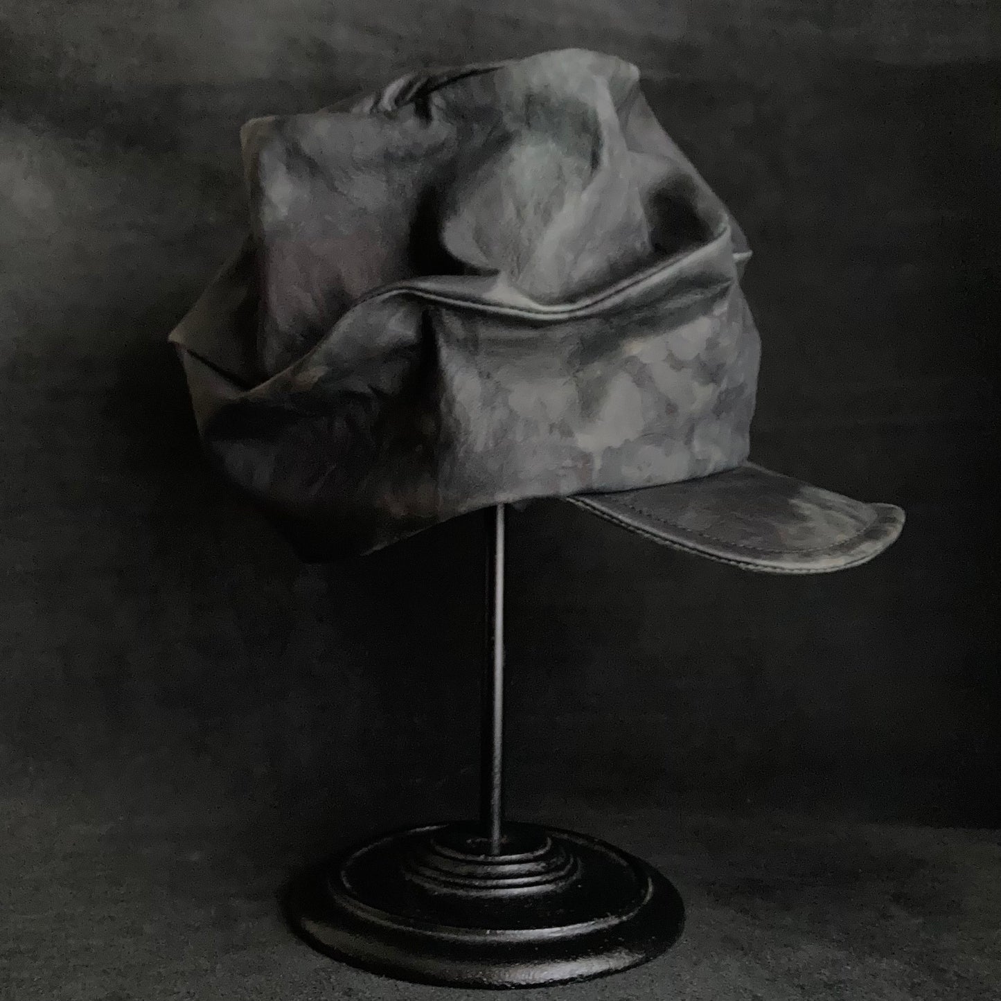 Rainy black leather turn cap