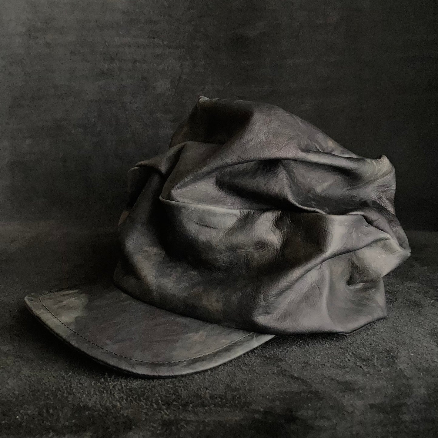 Rainy black leather turn cap