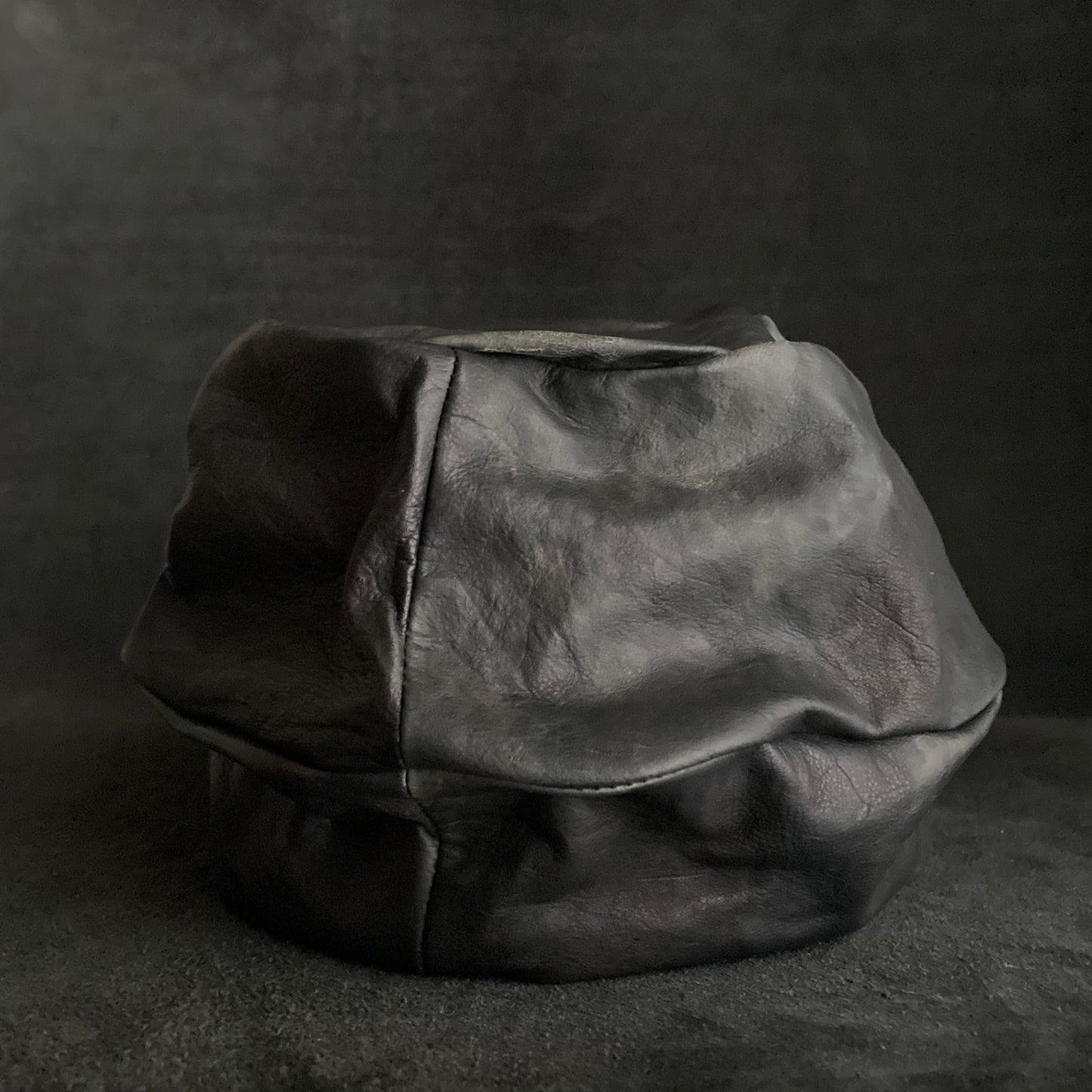 Rainy black leather turn cap