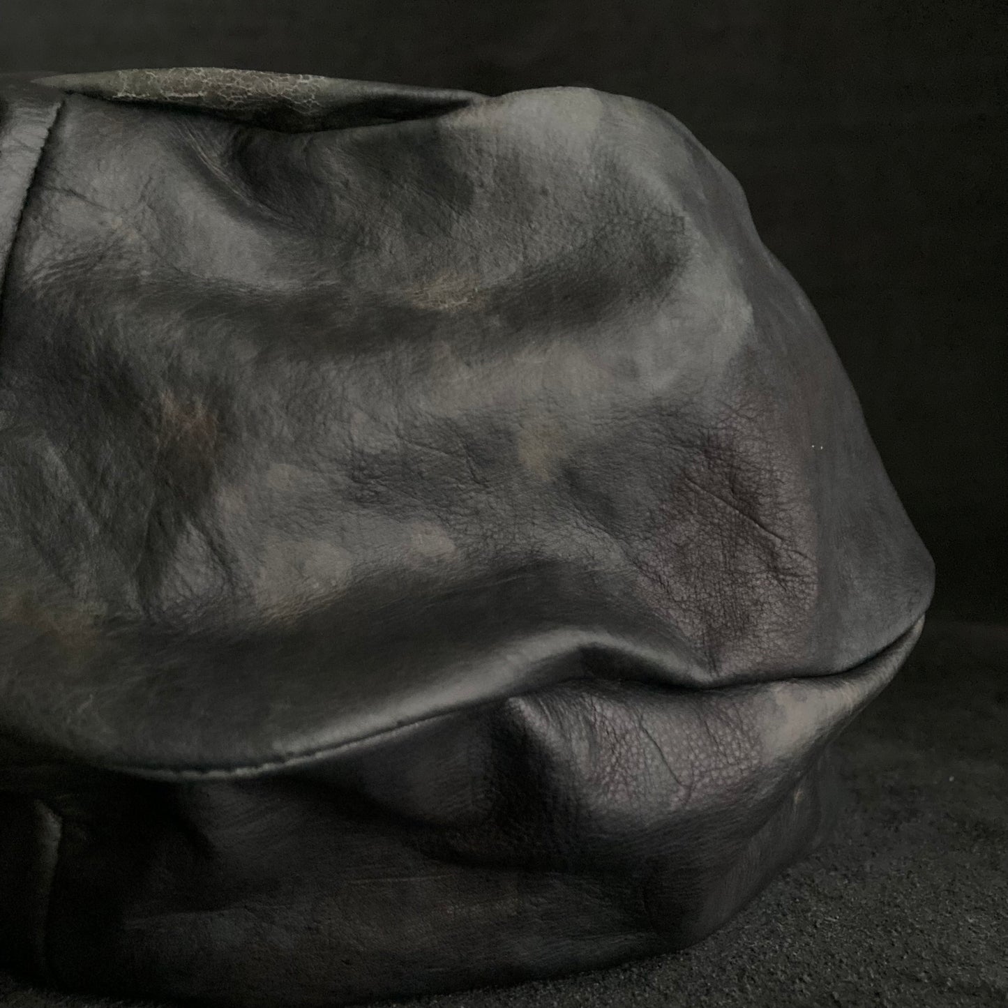 Rainy black leather turn cap