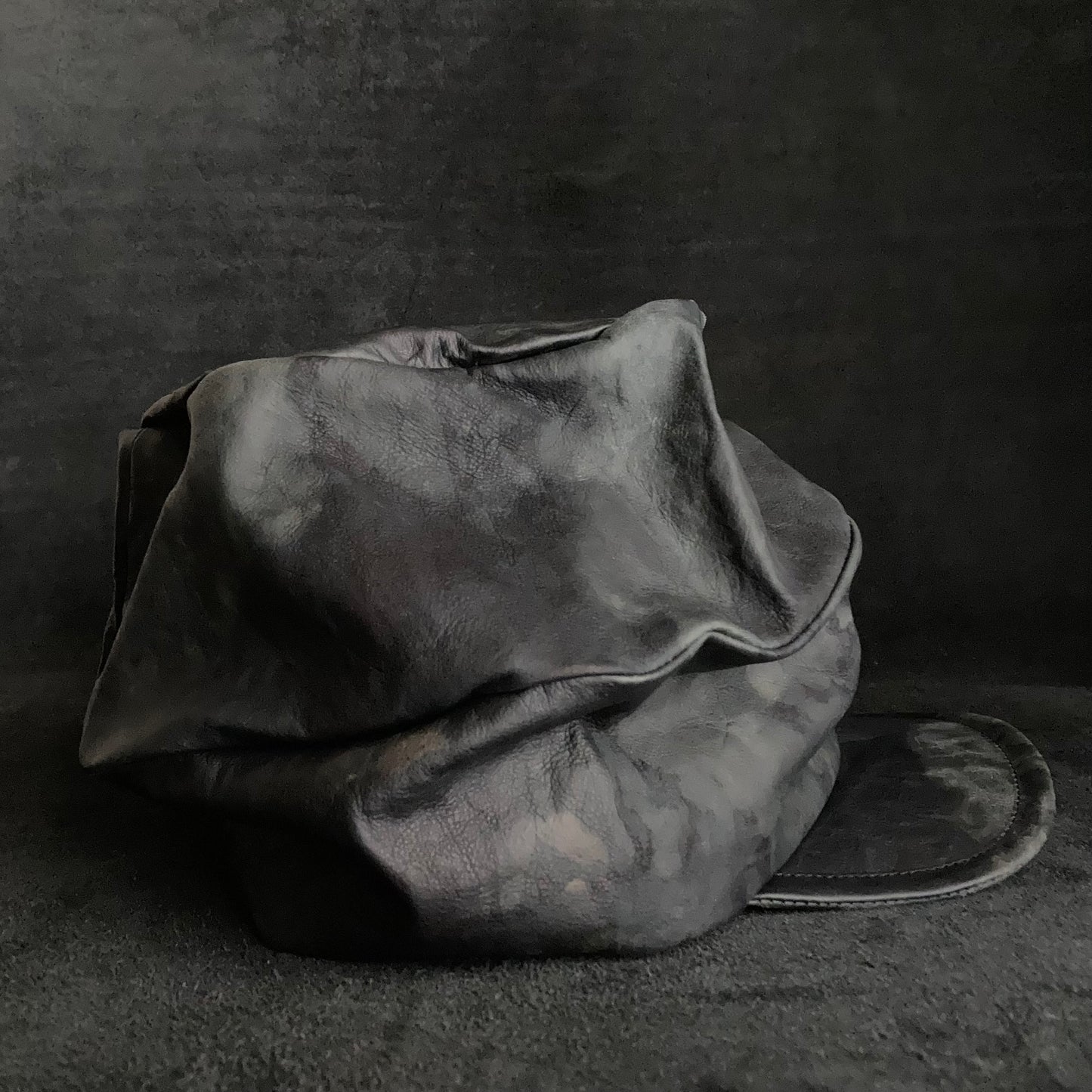 Rainy black leather turn cap