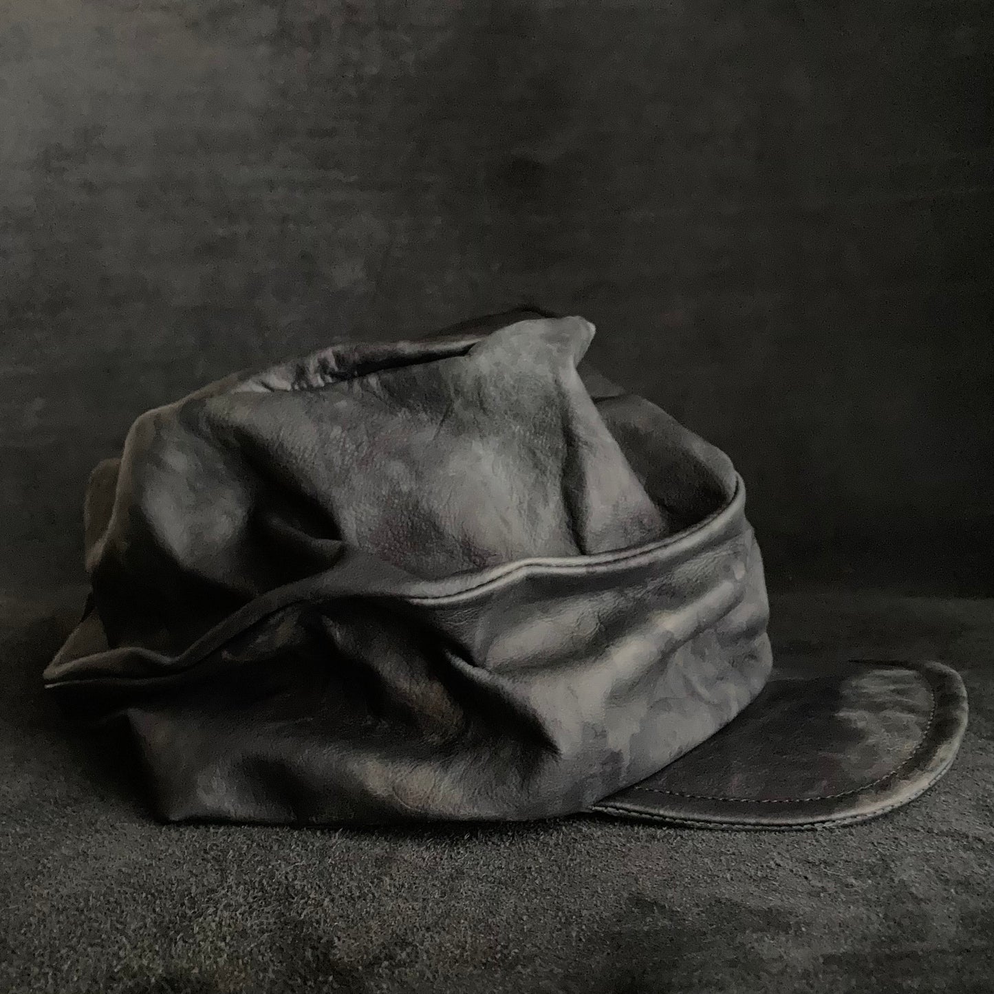 Rainy black leather turn cap