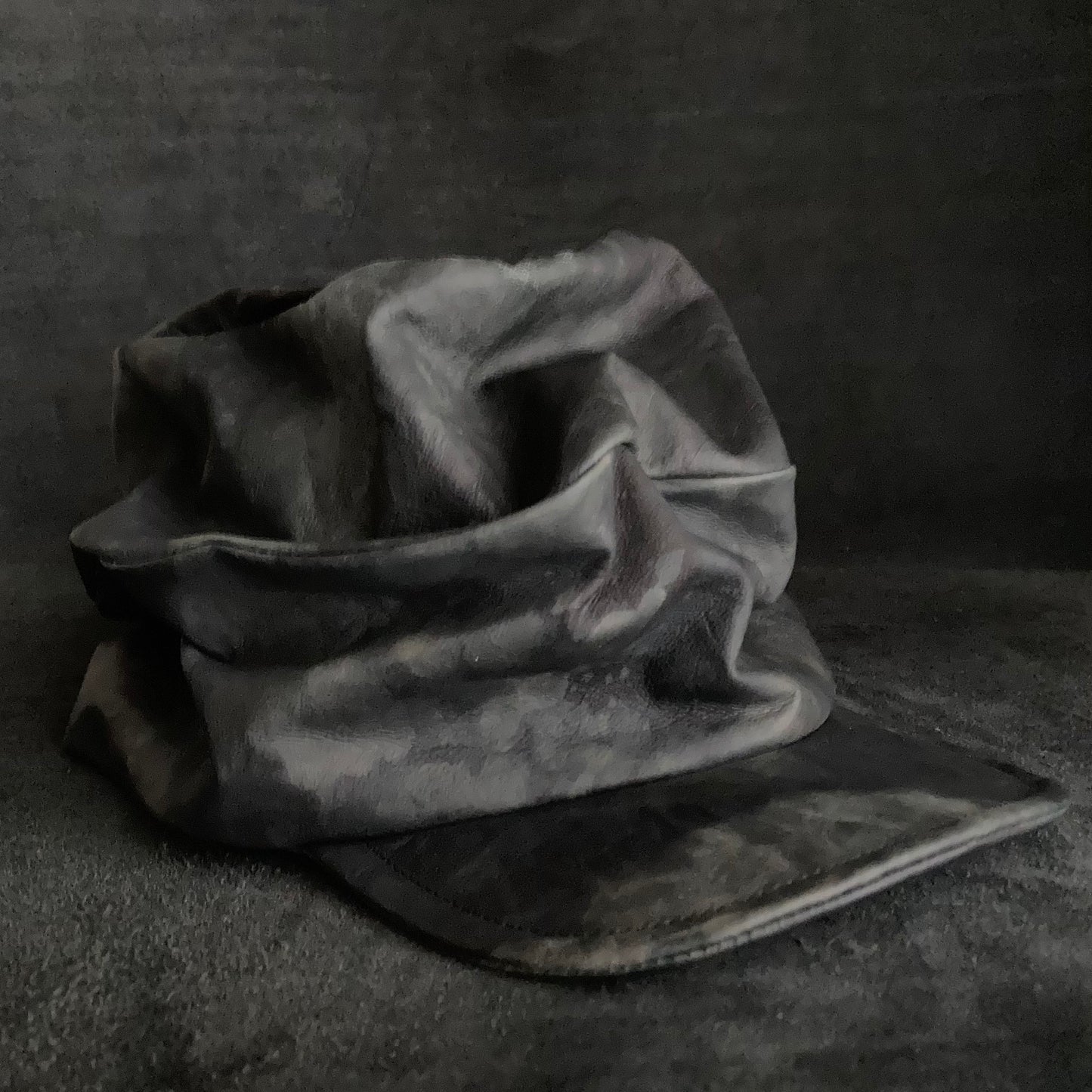 Rainy black leather turn cap