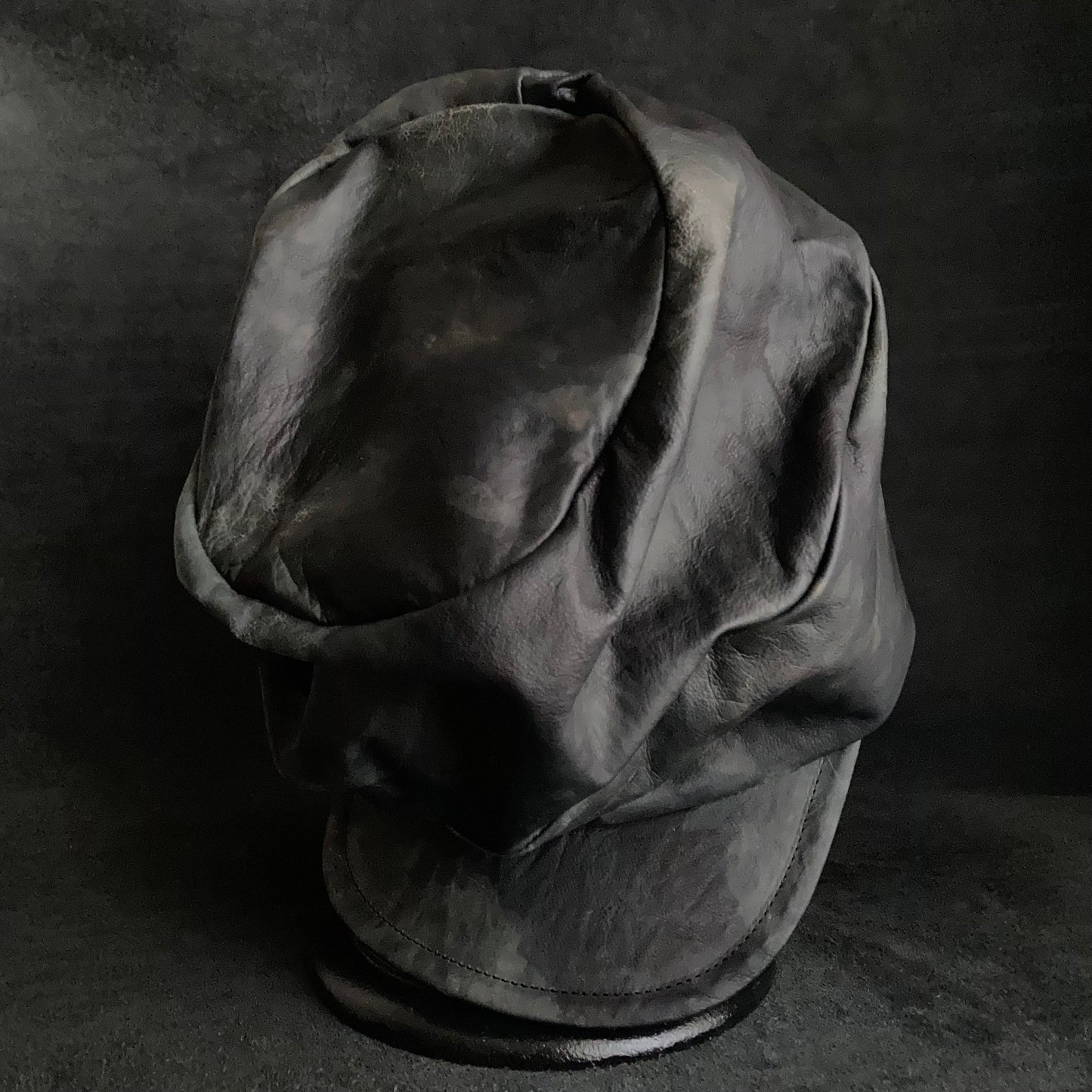 Rainy black leather turn cap