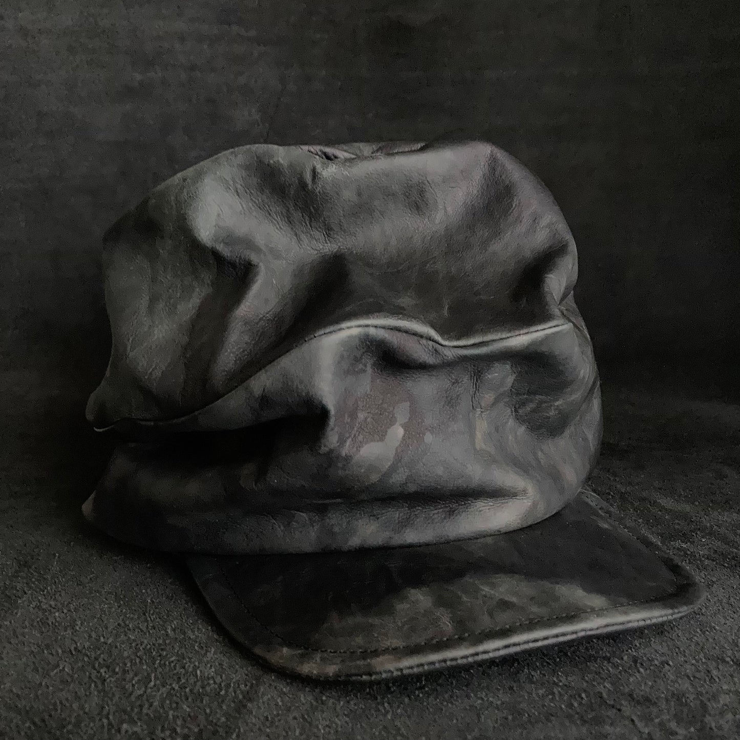 Rainy black leather turn cap