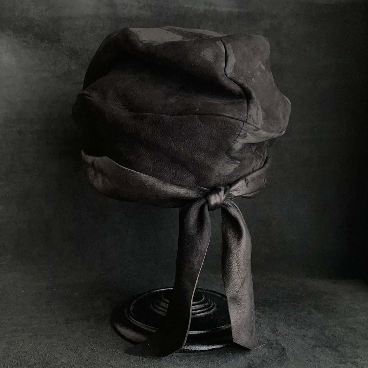 Bleaching black leather martial turn cap