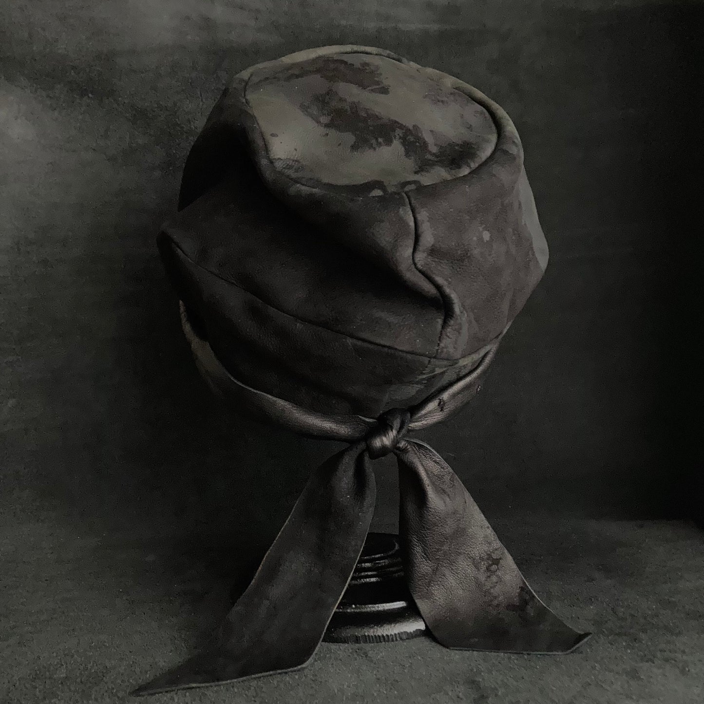 Bleaching black leather martial turn cap