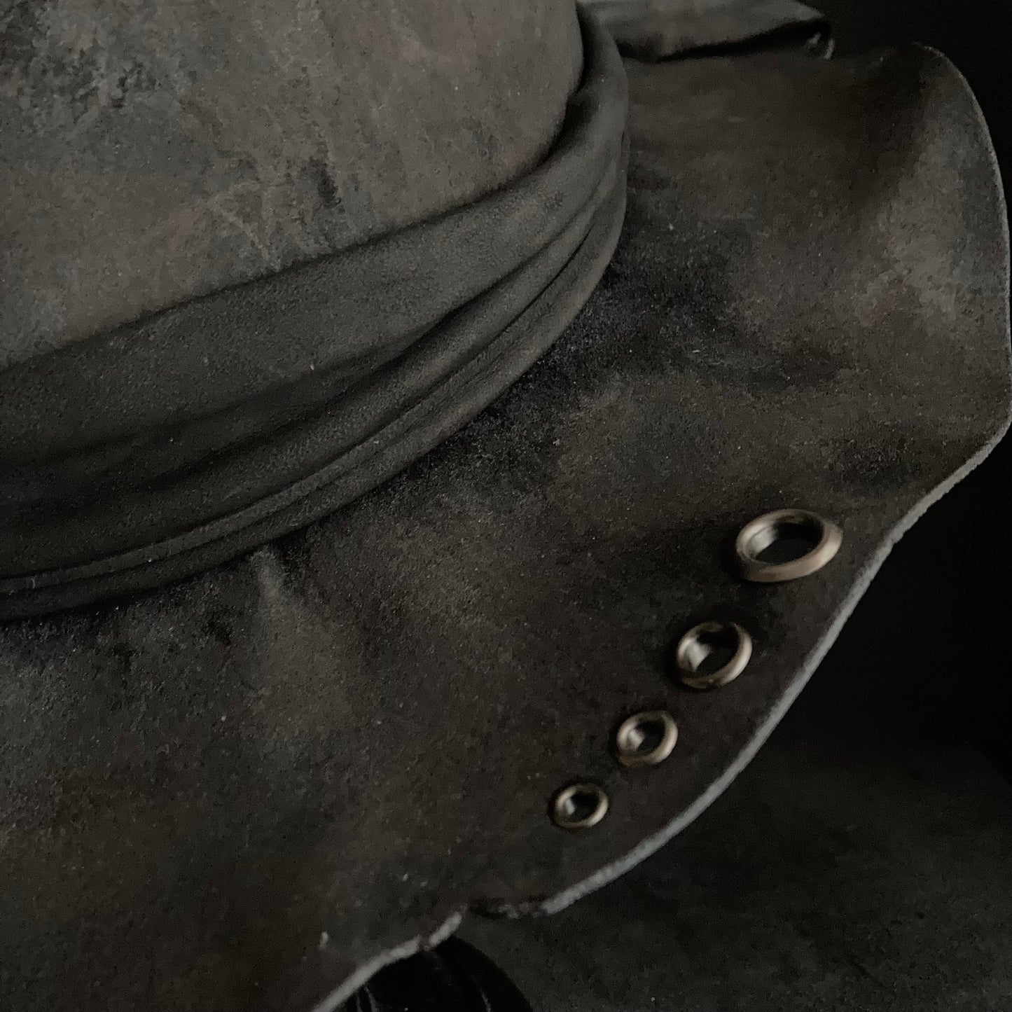 Charcoal eyelet back drooping leather fedora hat