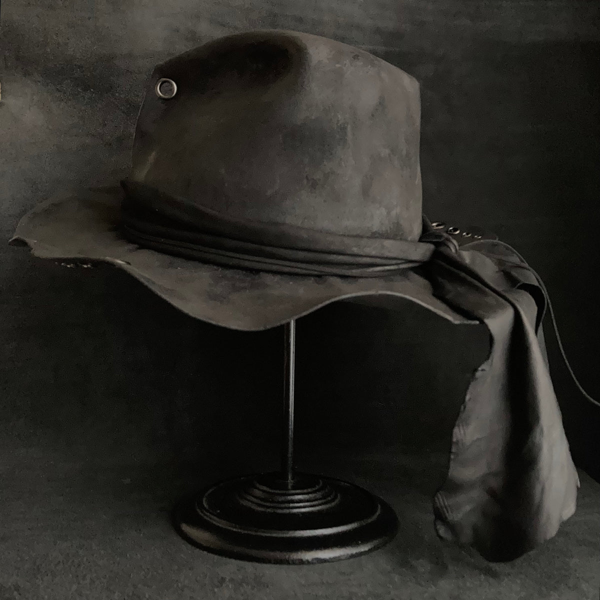 Charcoal eyelet back drooping leather fedora hat – triangles hat
