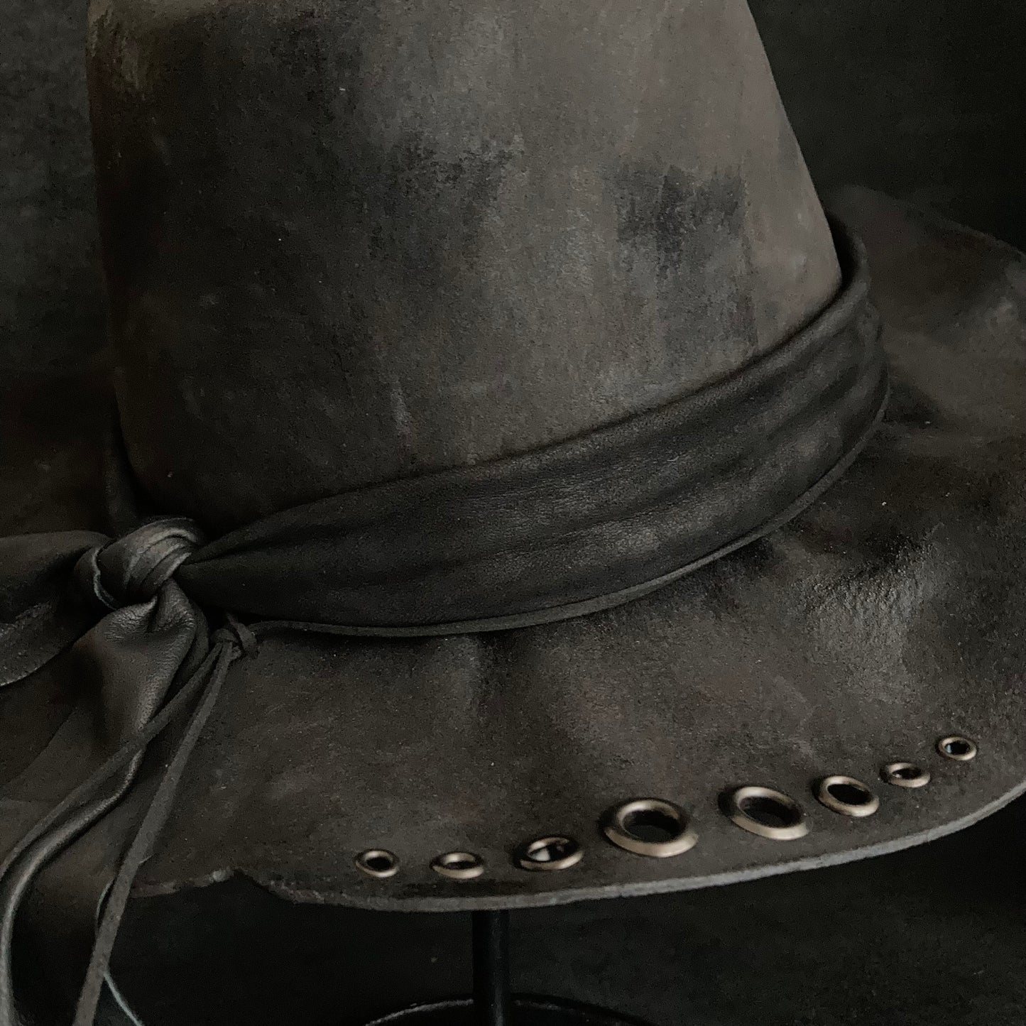 Charcoal eyelet back drooping leather fedora hat
