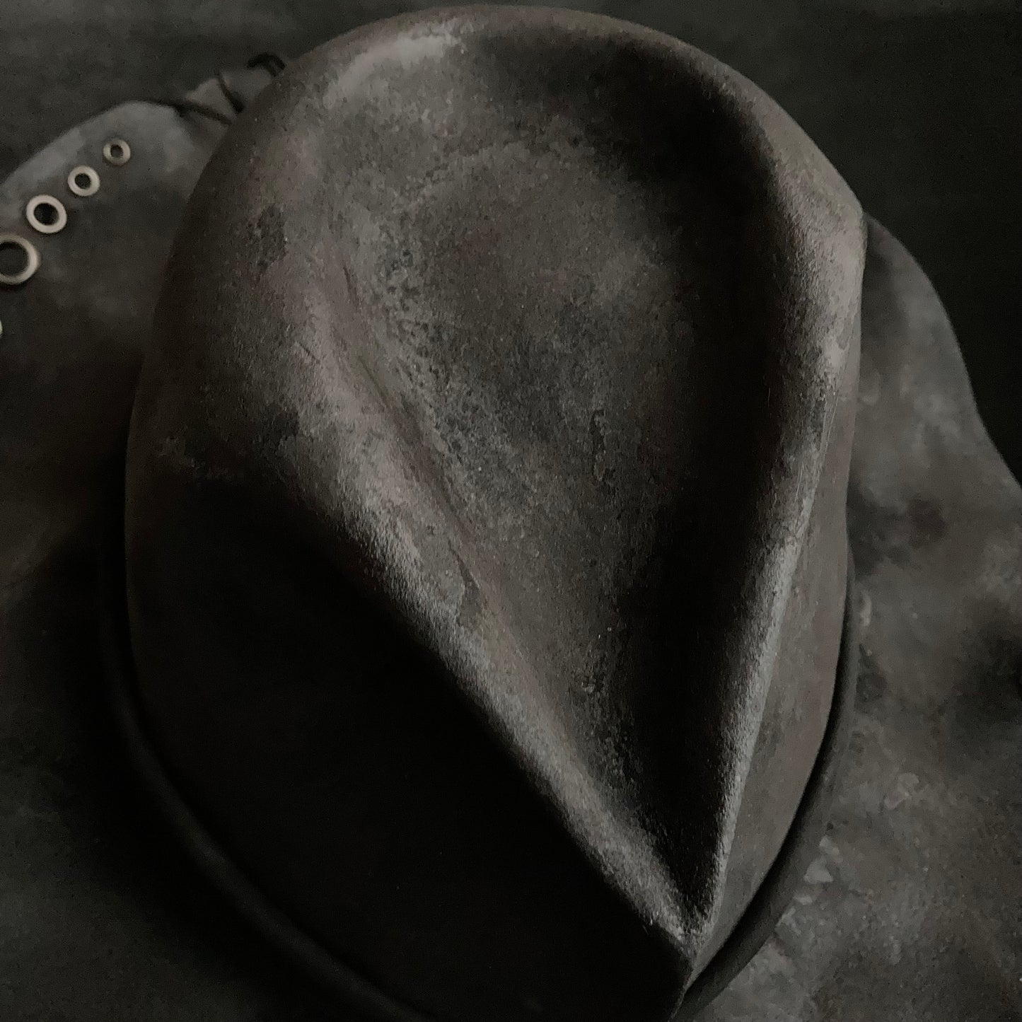 Charcoal eyelet back drooping leather fedora hat