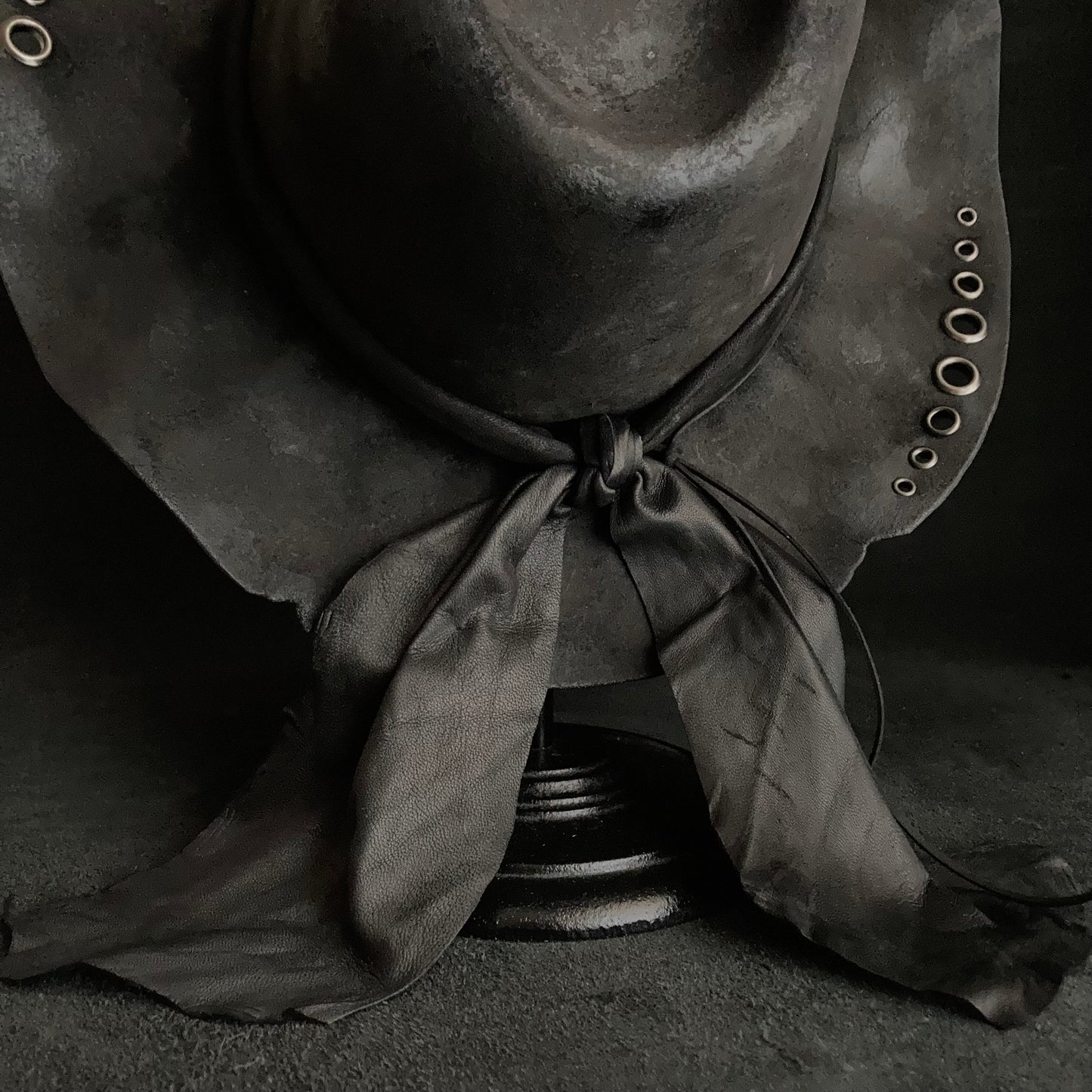 Charcoal eyelet back drooping leather fedora hat