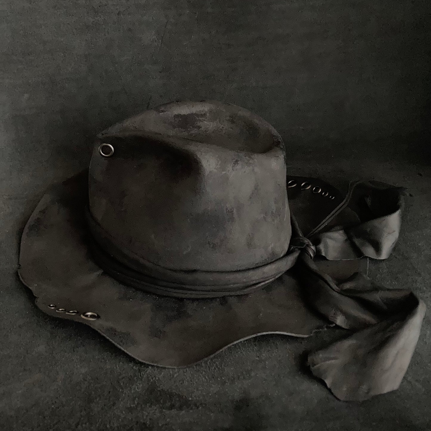 Charcoal eyelet back drooping leather fedora hat