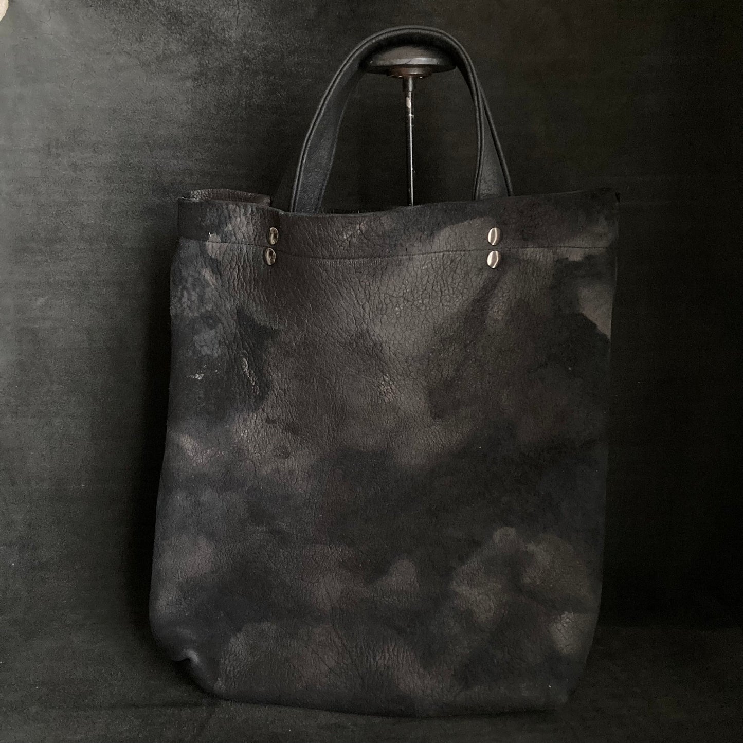 Bleached black leather tote bag