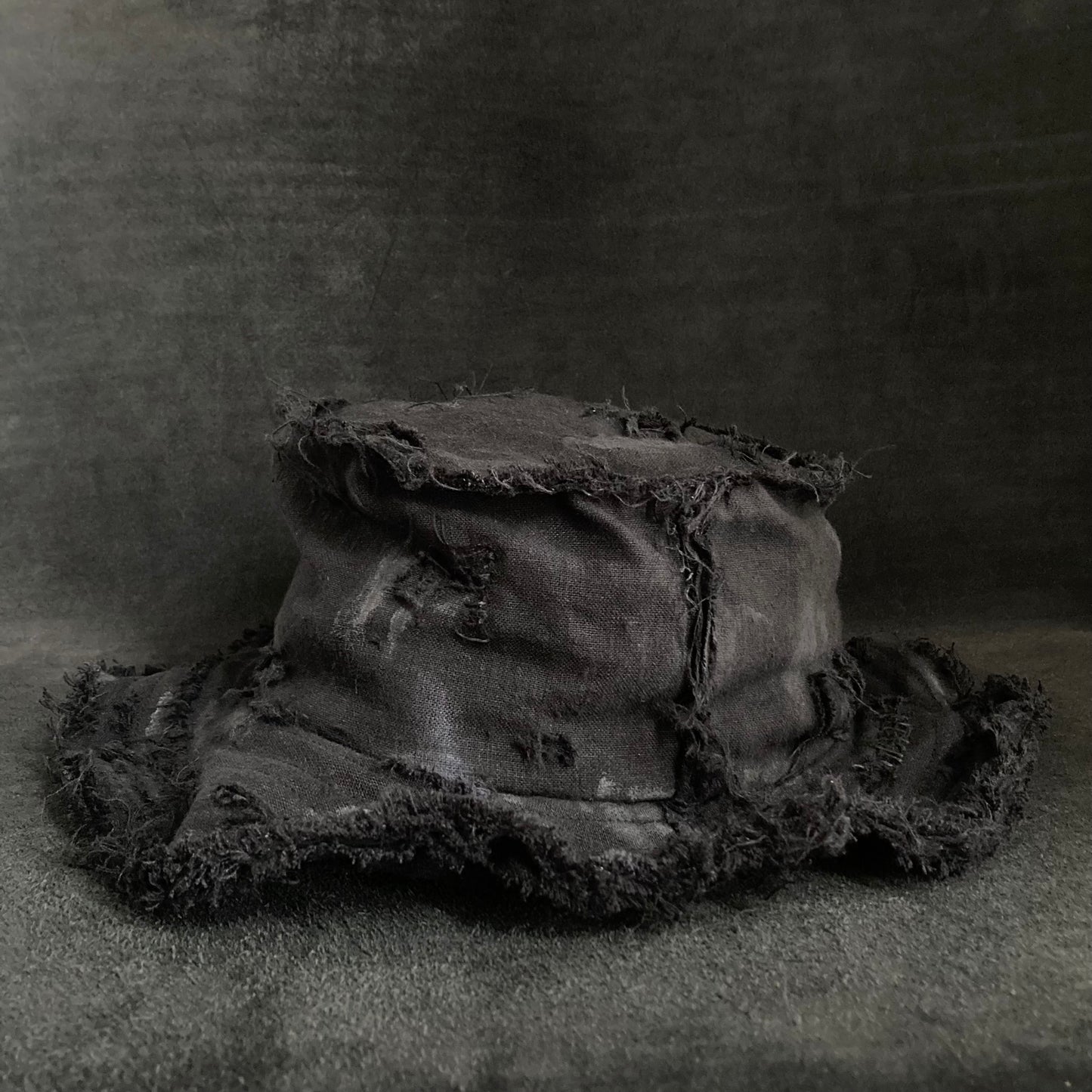 Back side black linen damage bucket hat