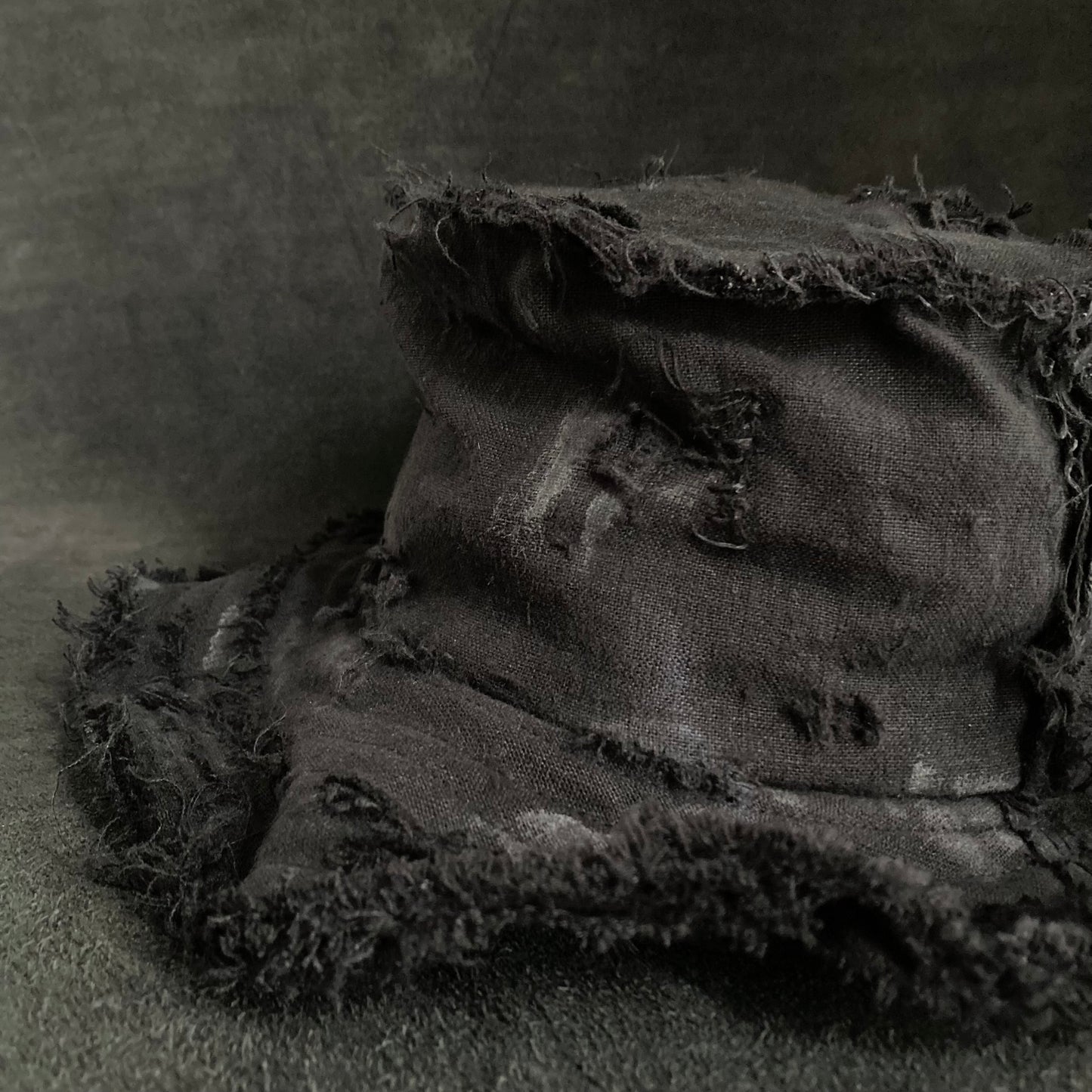 Back side black linen damage bucket hat