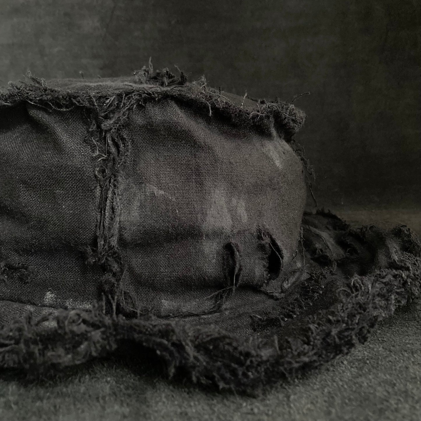 Back side black linen damage bucket hat