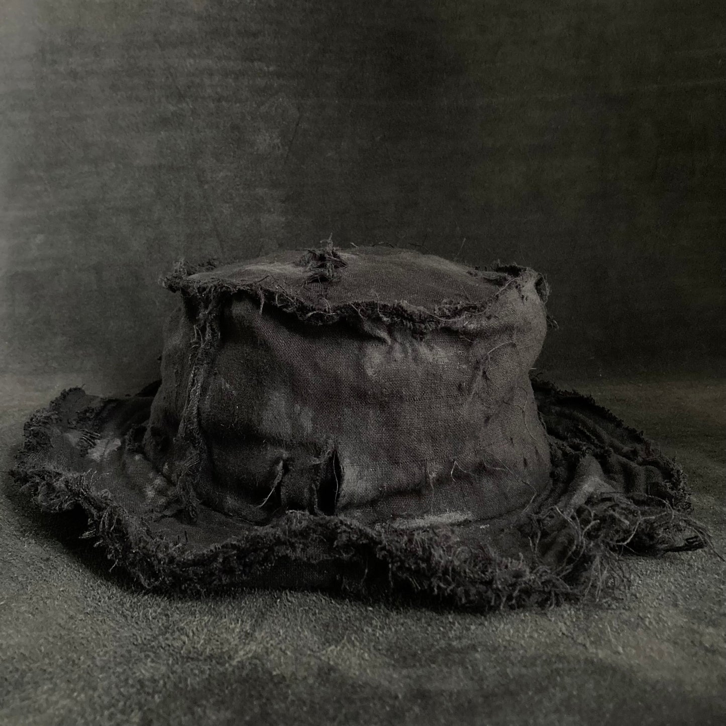 Back side black linen damage bucket hat