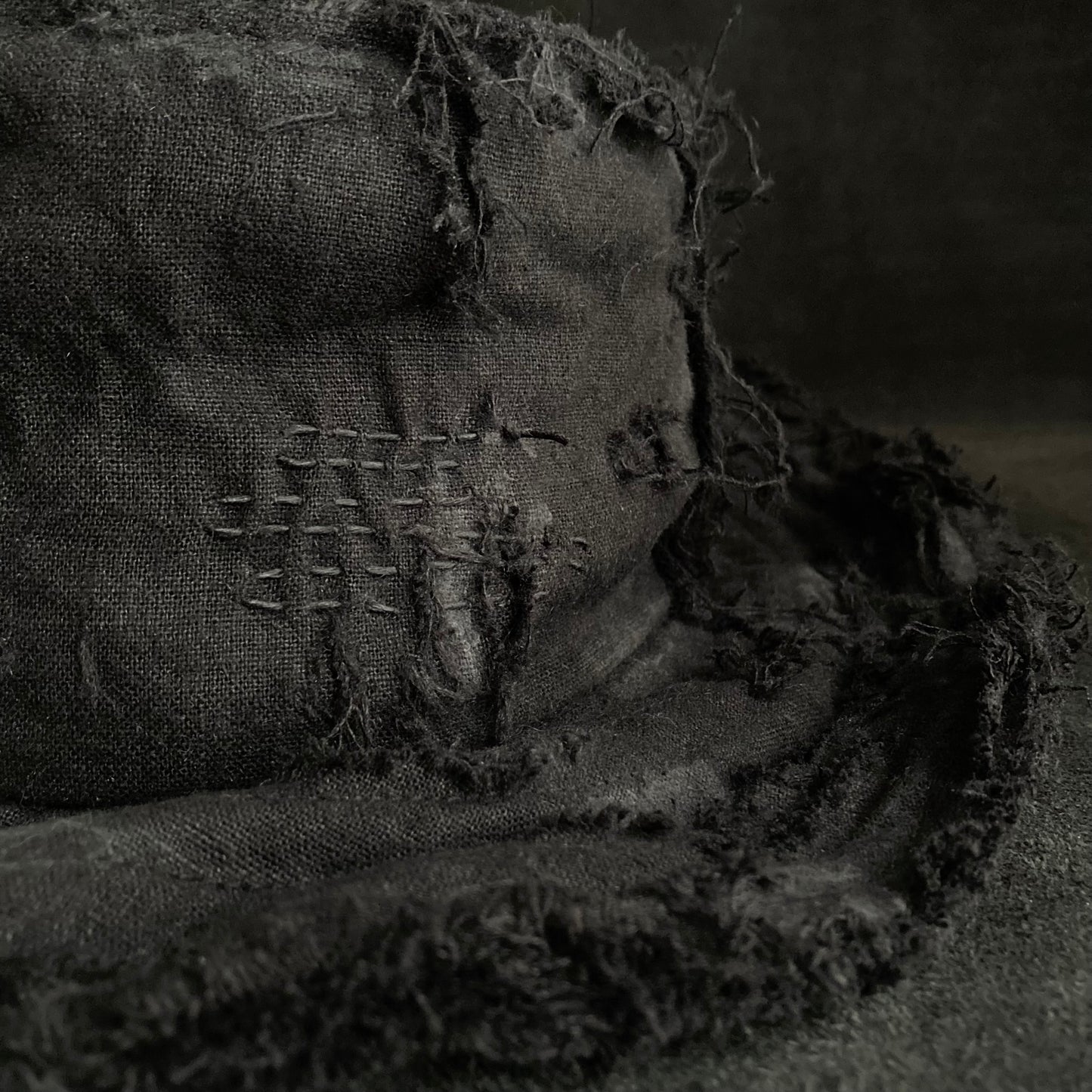 Back side black linen damage bucket hat