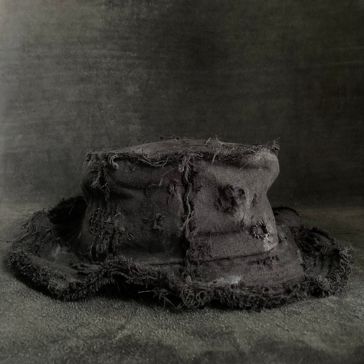 Back side black linen damage bucket hat