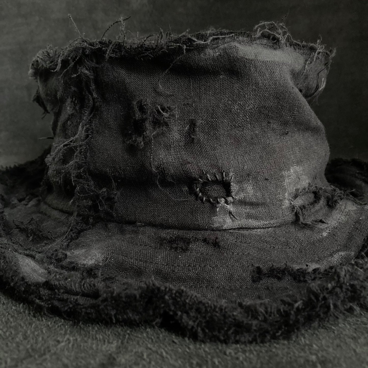 Back side black linen damage bucket hat