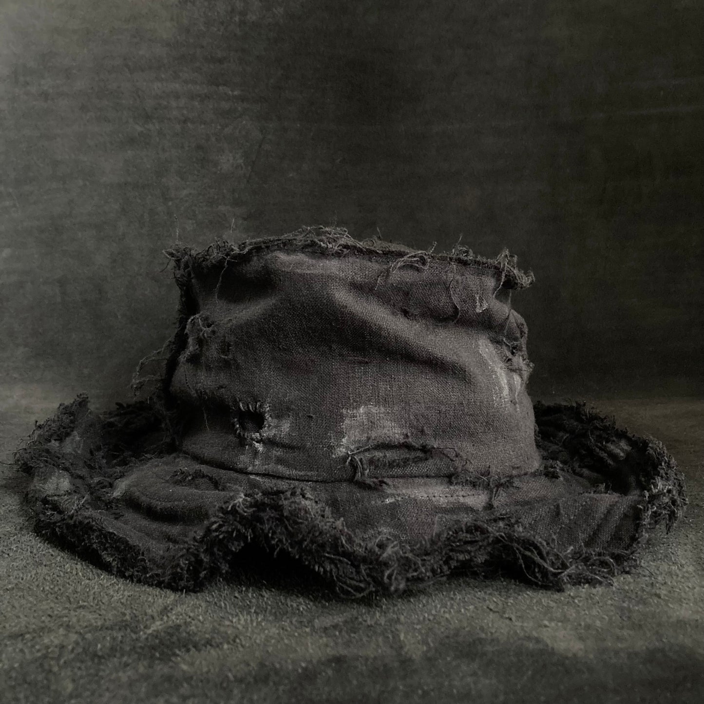 Back side black linen damage bucket hat