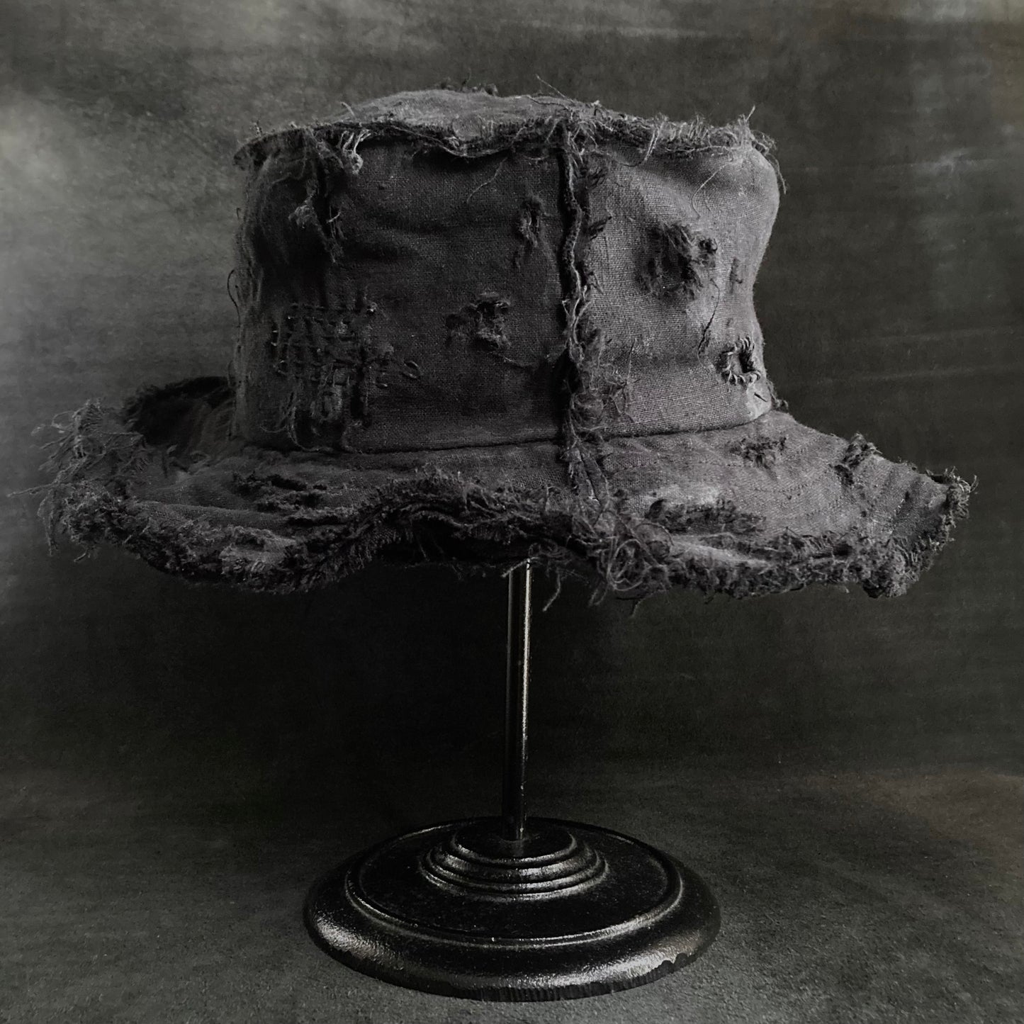 Back side black linen damage bucket hat