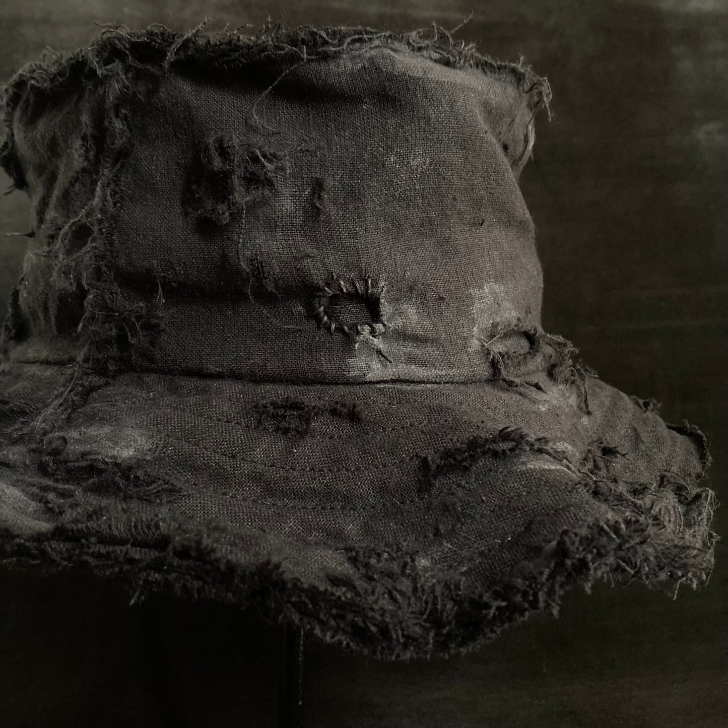 Back side black linen damage bucket hat