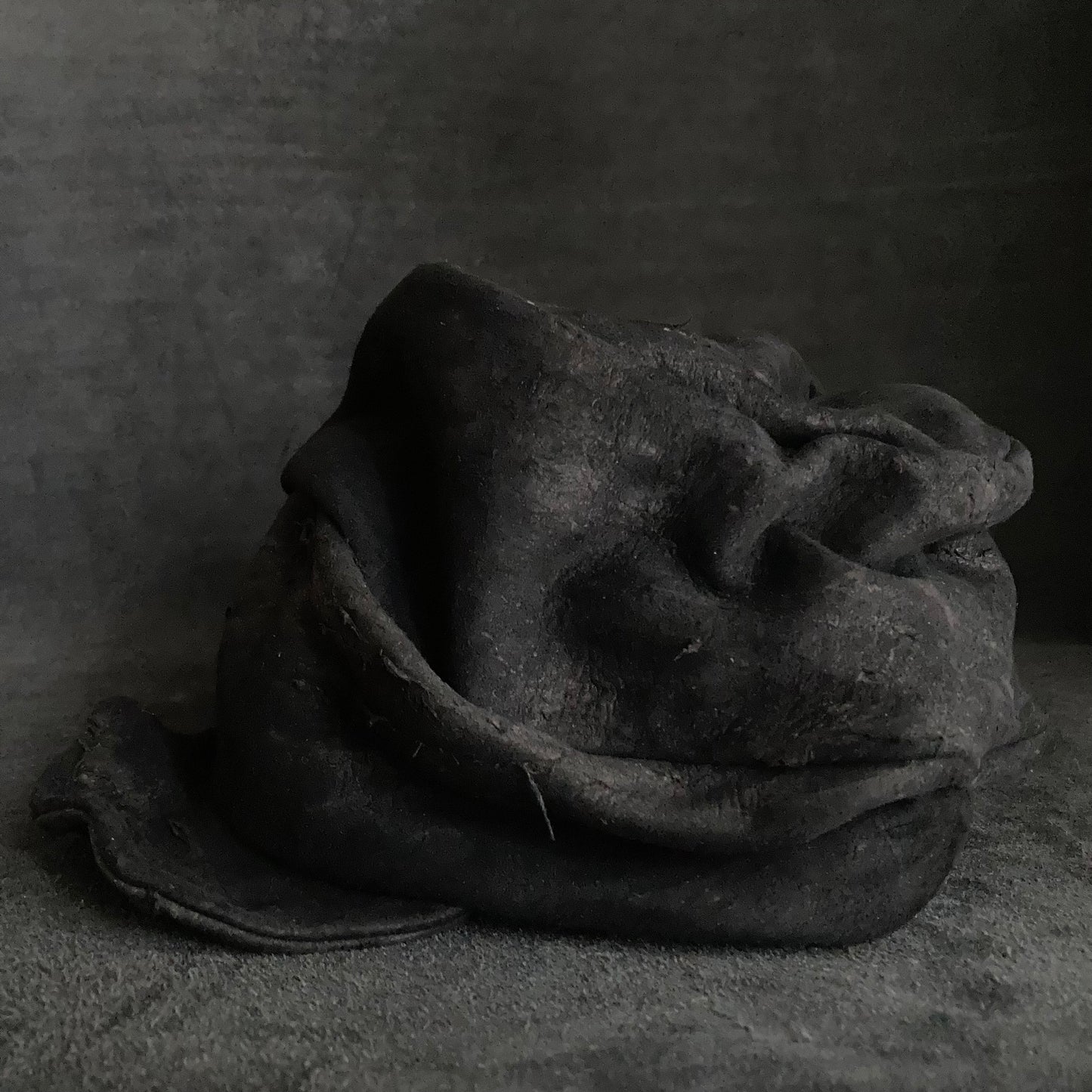 Floor under black leather turn cap