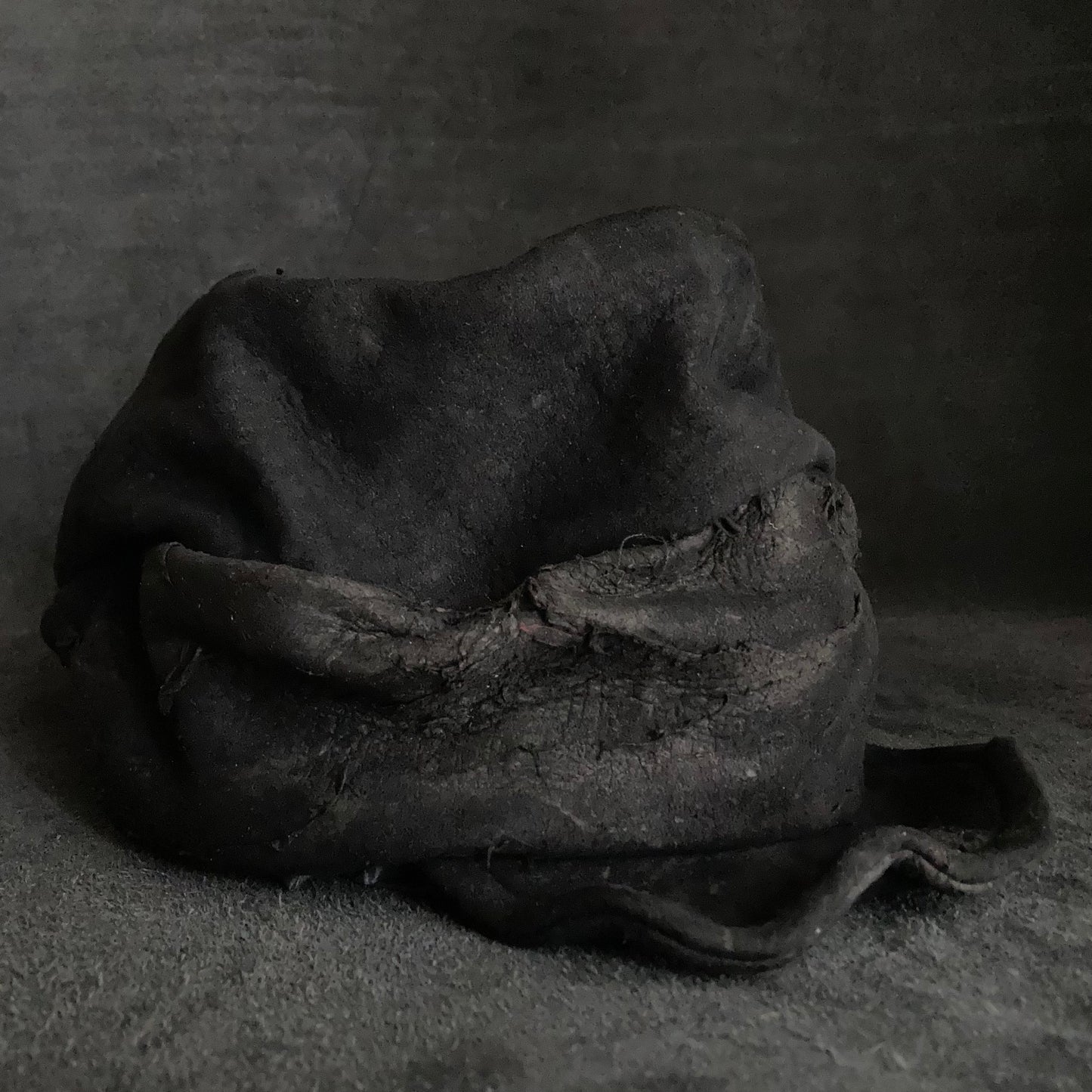 Floor under black leather turn cap