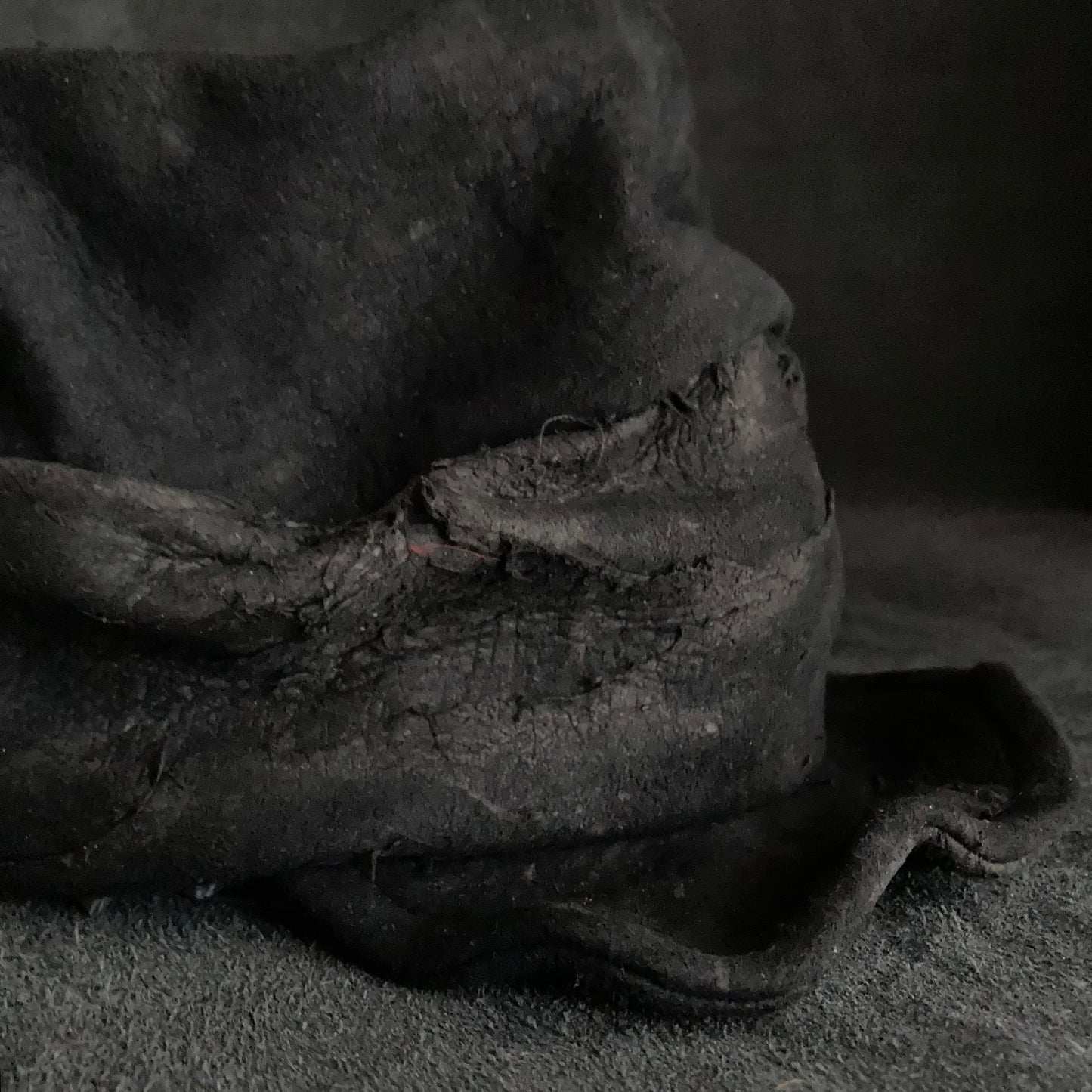 Floor under black leather turn cap