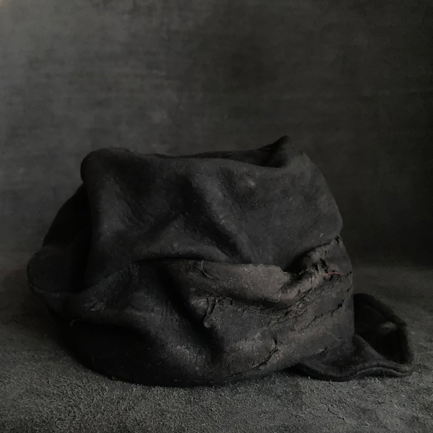 Floor under black leather turn cap
