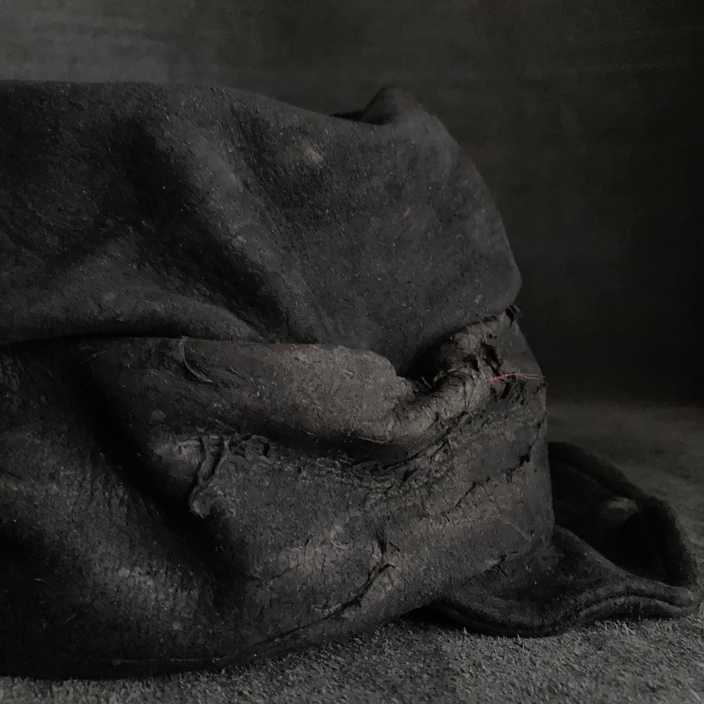 Floor under black leather turn cap