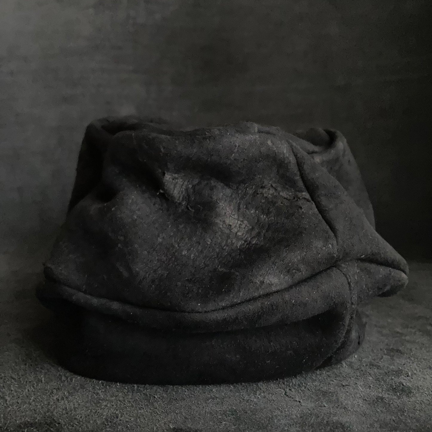 Floor under black leather turn cap