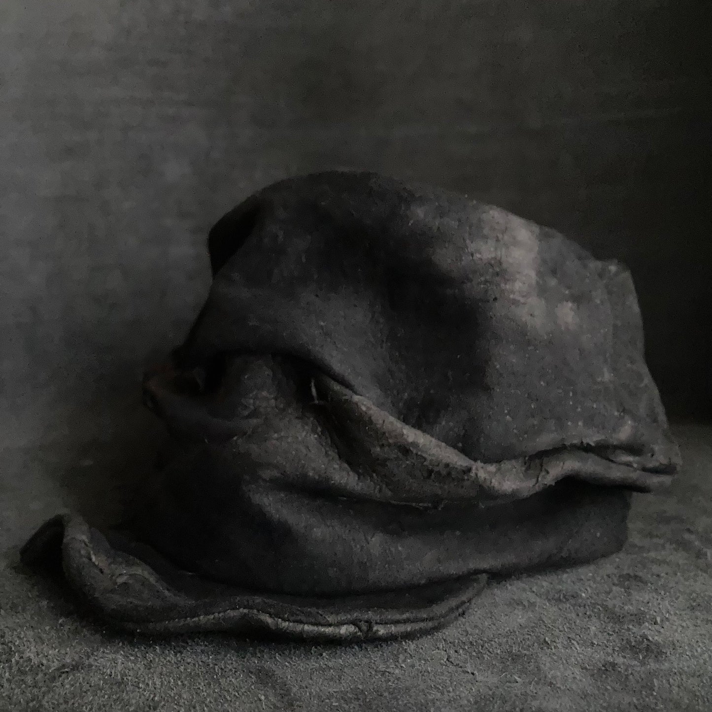 Floor under black leather turn cap