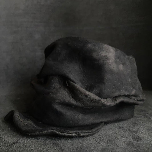 Floor under black leather turn cap