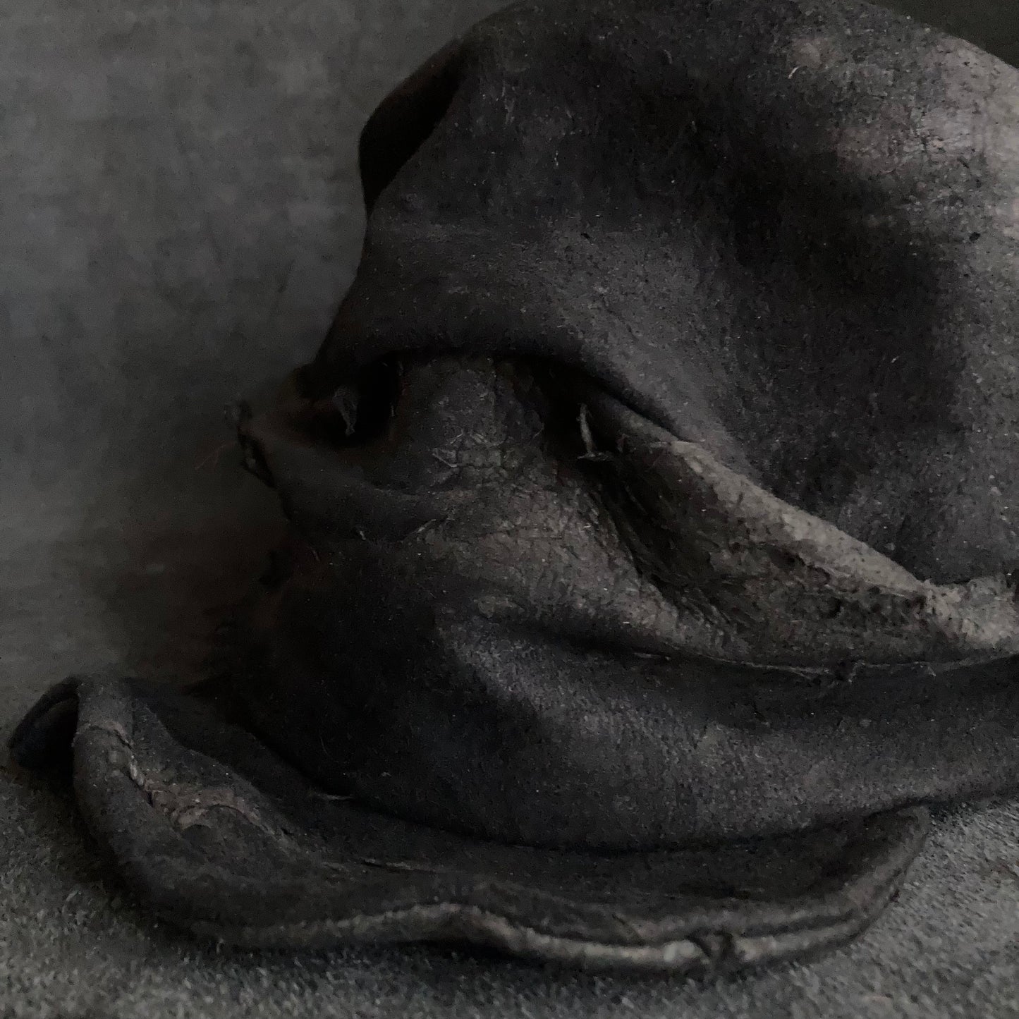 Floor under black leather turn cap