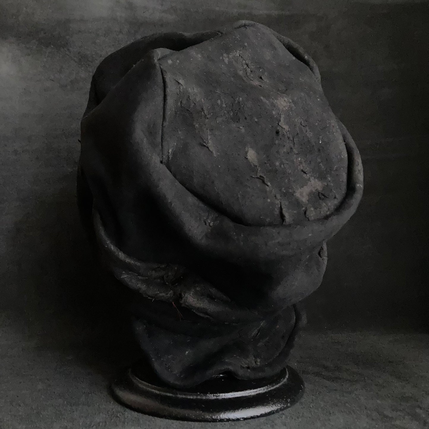 Floor under black leather turn cap